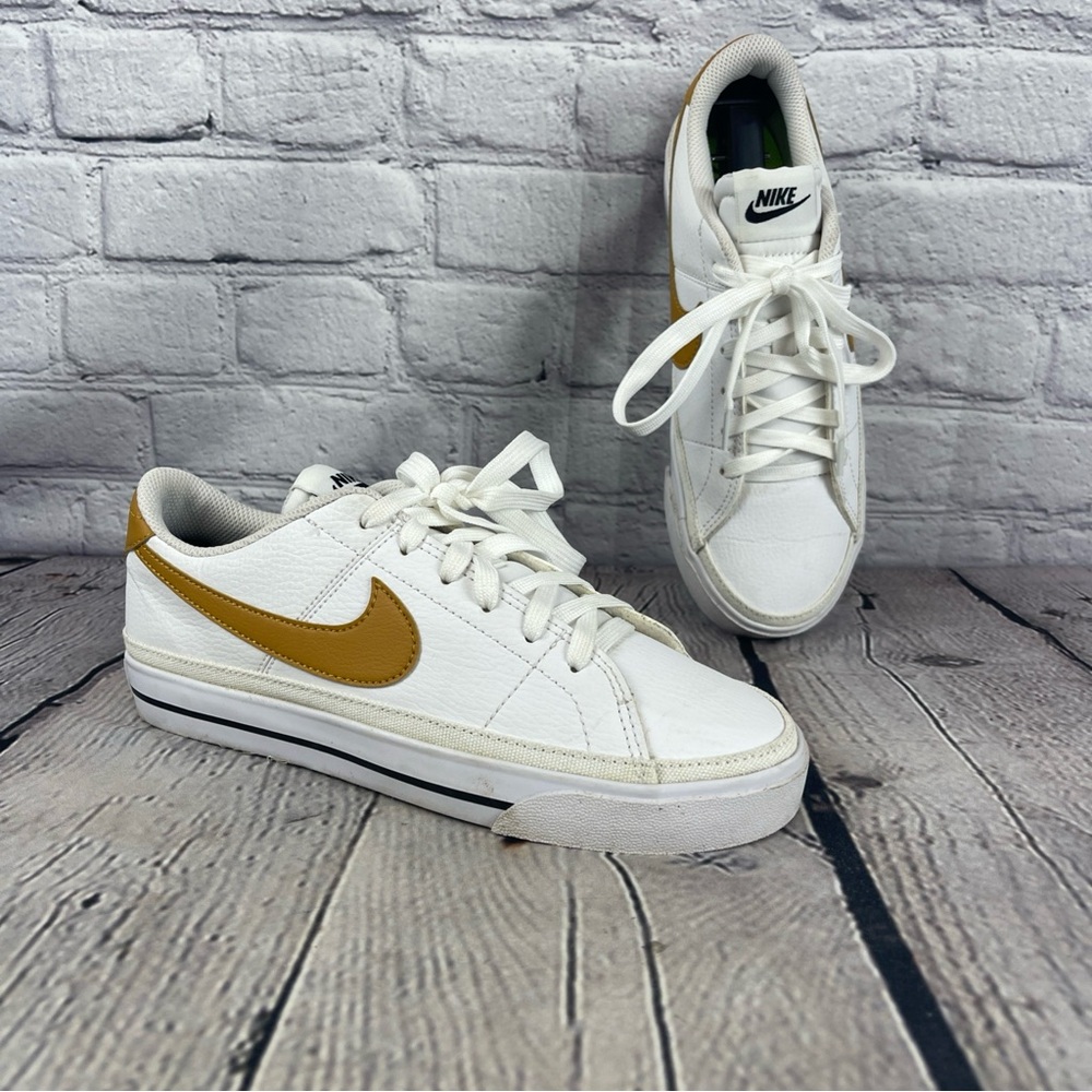 Nike White Low-Top Sneakers with Mustard Gold Swoosh